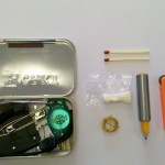 2 Waterproof matches, 1 Cotton Firestarter, 20" Trip Wire, 1 Pencil, 10 ft Duct Tape, 1 Fire Sparker