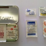 1 Salt Pack, 1 Sugar Pack, 2 Pain Reliever Pills, 1 Antibiotic Ointment
