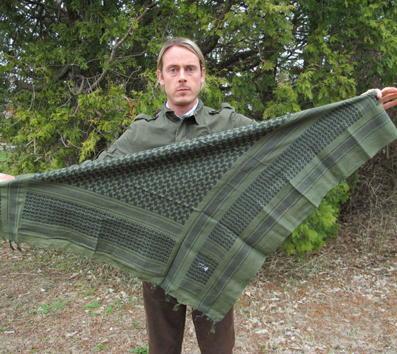 How to Tie a Shemagh STEP 2 Fold it in half to form a triangle