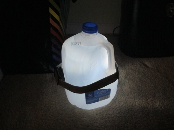 Headlamp around gallon bottle jug of water diy emergency light.